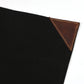 Tablier de toile cirée noire et cuir marron noyer